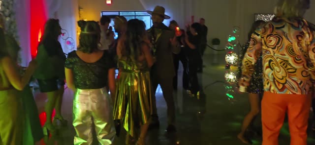 Guests filling the dance floor at a 20th anniversary celebration